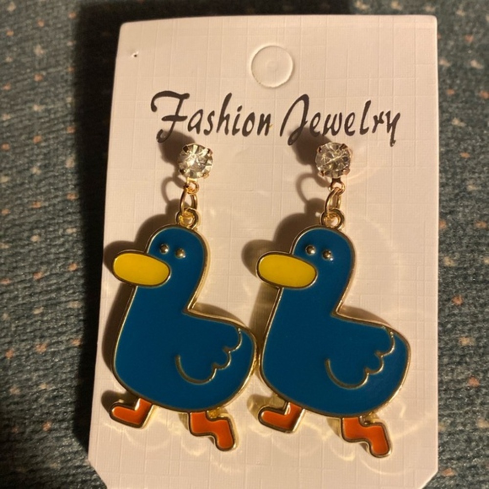 Blue Duck Earrings with rhinestone at top.